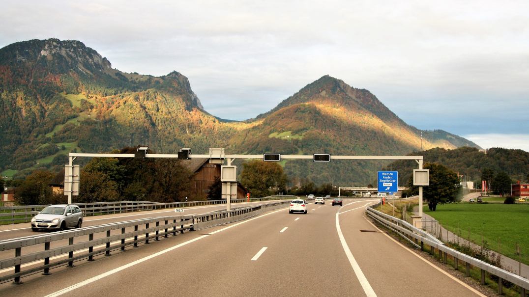 Highway through a green mountain valley